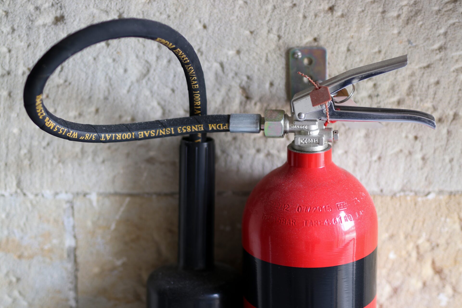 Quality Fire extinguisher mounted on a wall