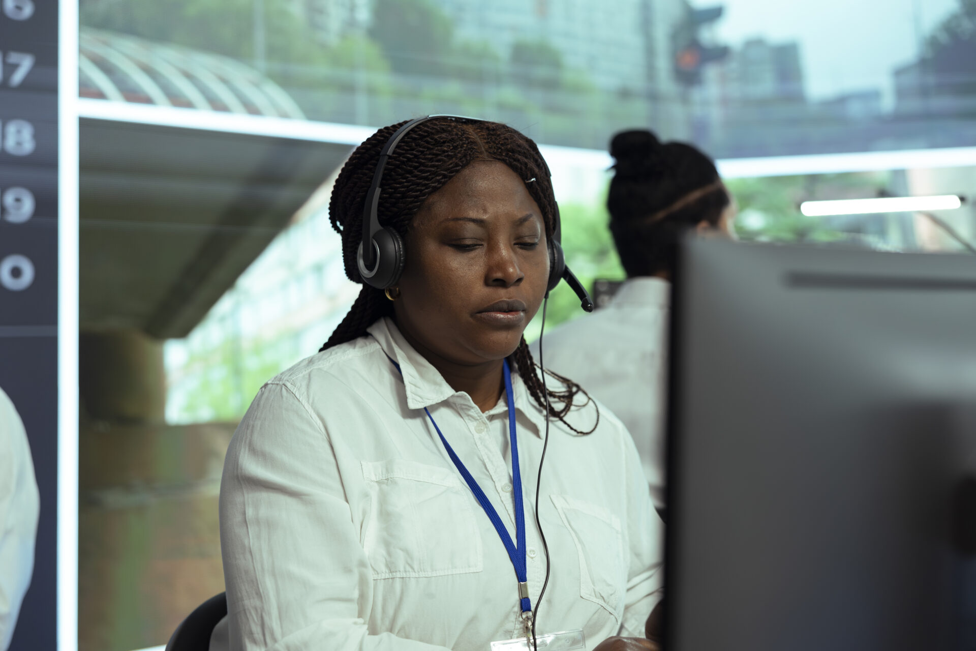 Woman at a call center - illustrating a way to contact us at Q Fire Protection